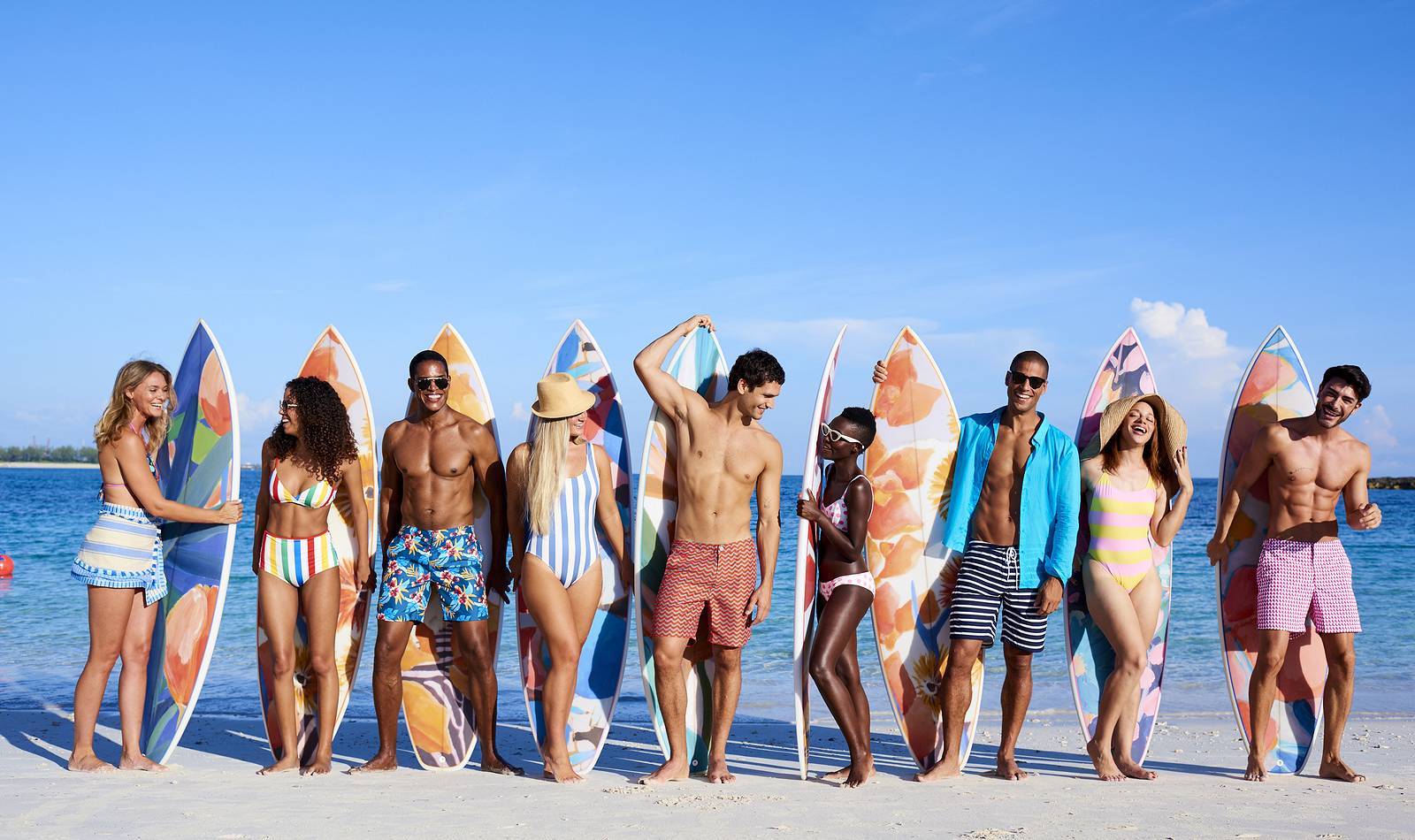 the cove beach guests with surfboards